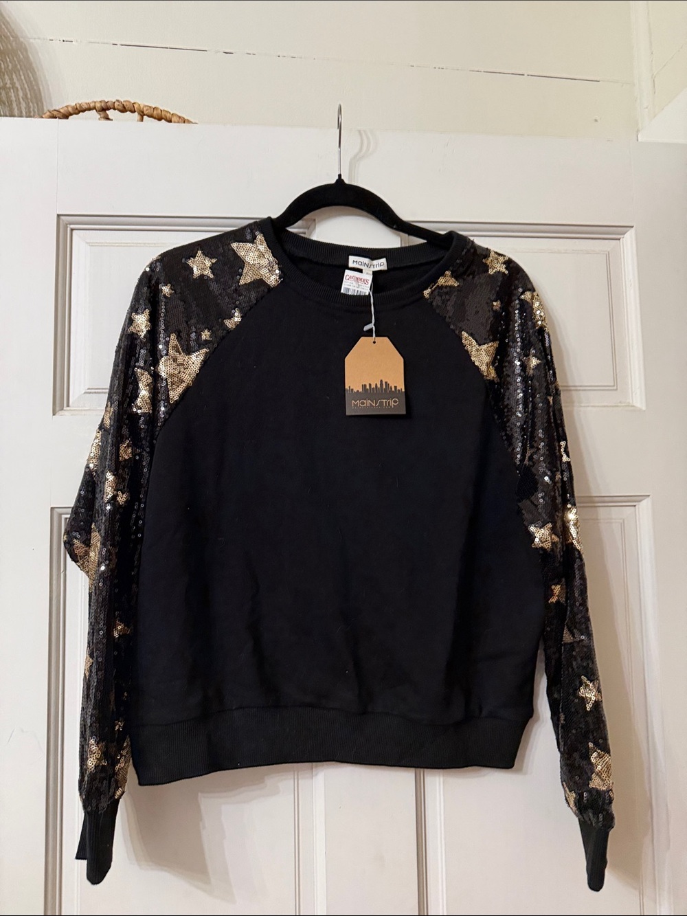 Main Strip Black Top with Gold Accent Tag